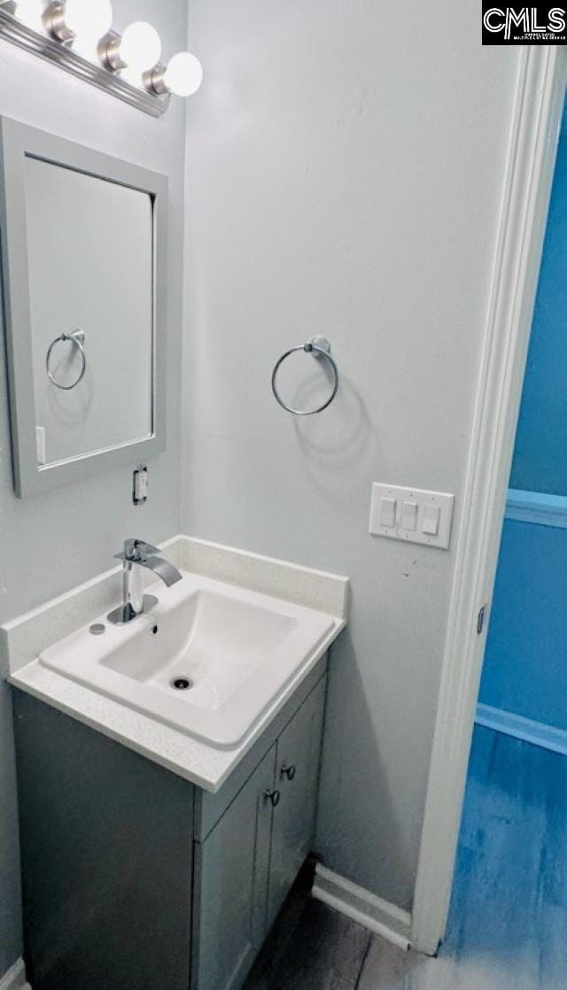 bathroom featuring vanity and baseboards