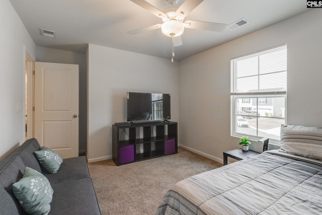 bedroom with carpet floors, visible vents, ceiling fan, and baseboards