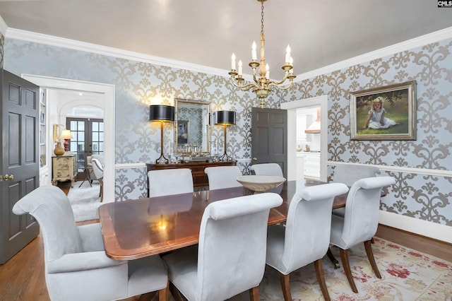 dining space featuring wallpapered walls, wood finished floors, and french doors