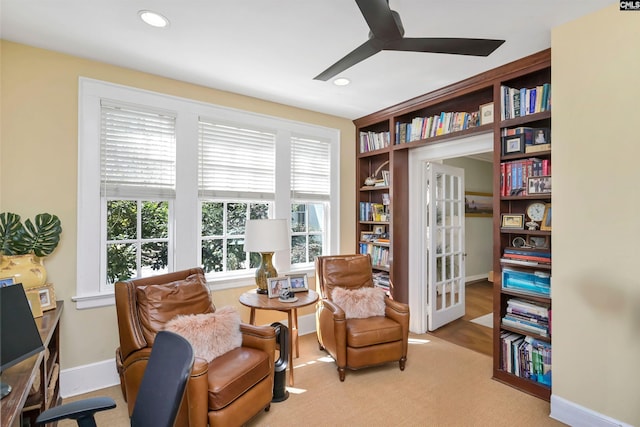 sitting room with a ceiling fan, recessed lighting, and baseboards