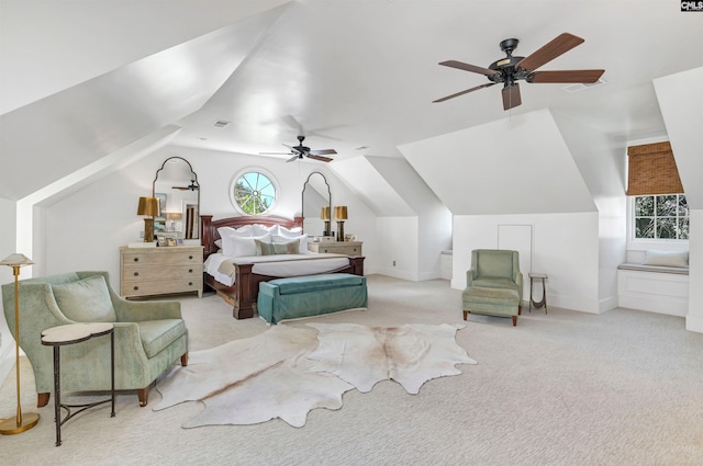 carpeted bedroom with a ceiling fan, visible vents, vaulted ceiling, and baseboards