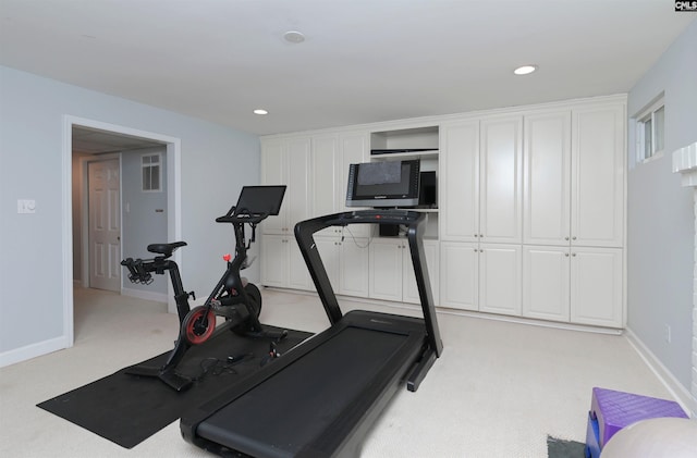 exercise room featuring recessed lighting, light carpet, and baseboards