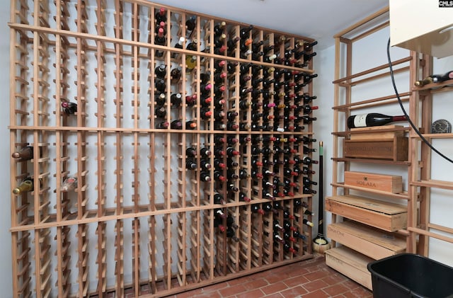 wine room with brick floor