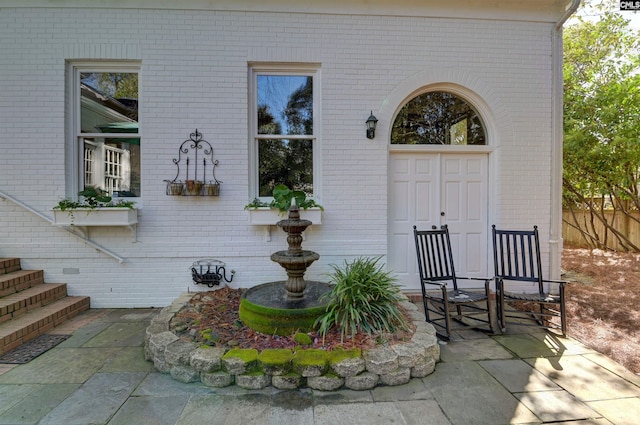 entrance to property with brick siding