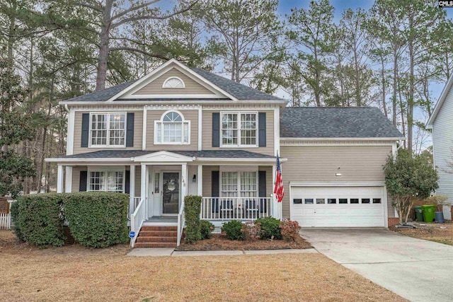 view of front of property with driveway, a shingled roof, a garage, and a porch