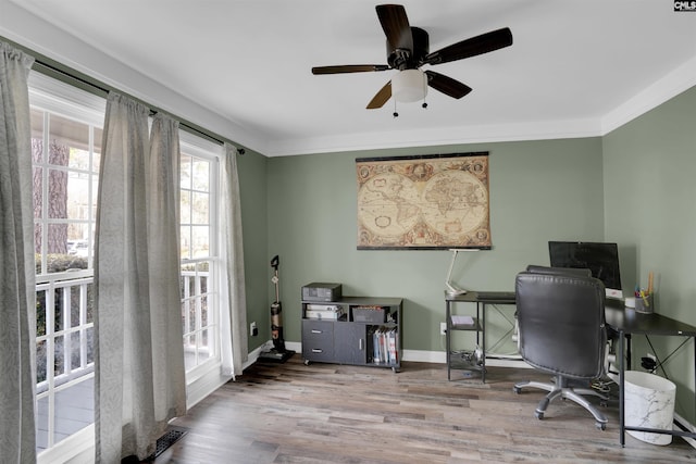 office area featuring baseboards, wood finished floors, and crown molding