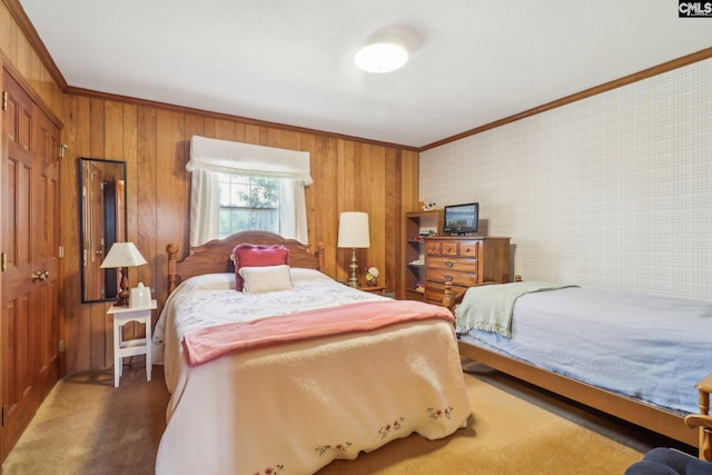 bedroom with carpet flooring and crown molding