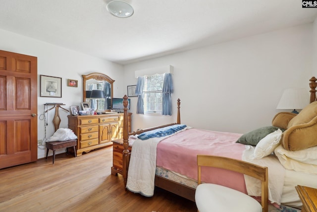 bedroom featuring wood finished floors