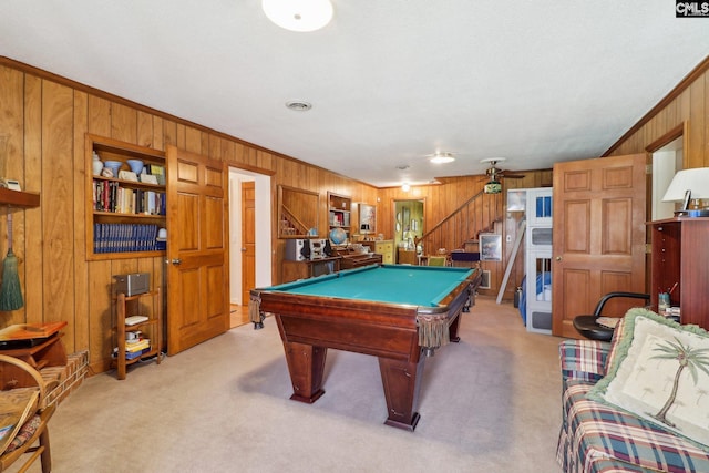 recreation room featuring light carpet, wood walls, billiards, and crown molding