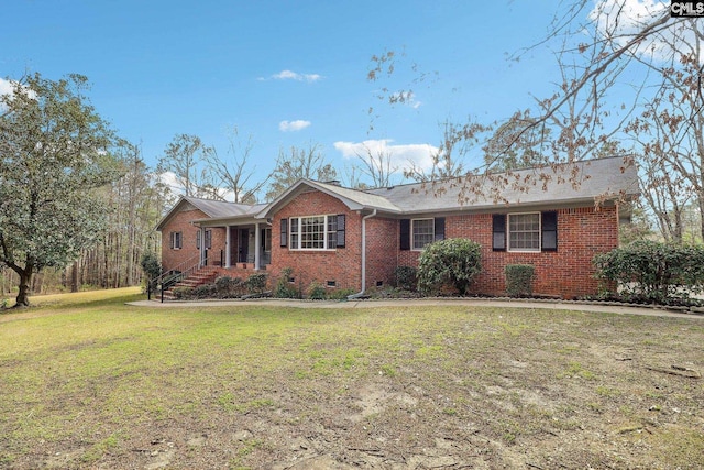 ranch-style home featuring crawl space, brick siding, and a front yard