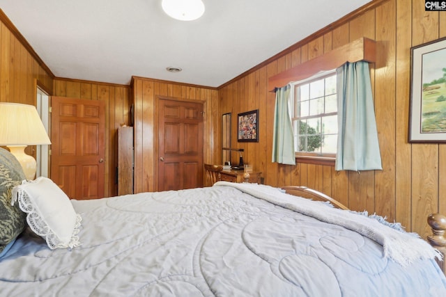 bedroom with wooden walls and ornamental molding