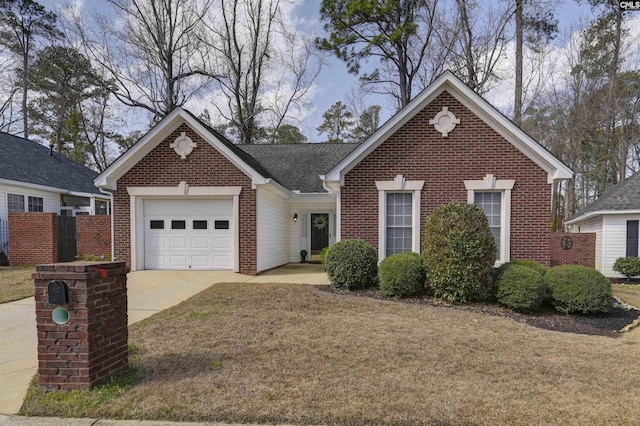 view of front of home with brick siding, an attached garage, a front yard, fence, and driveway