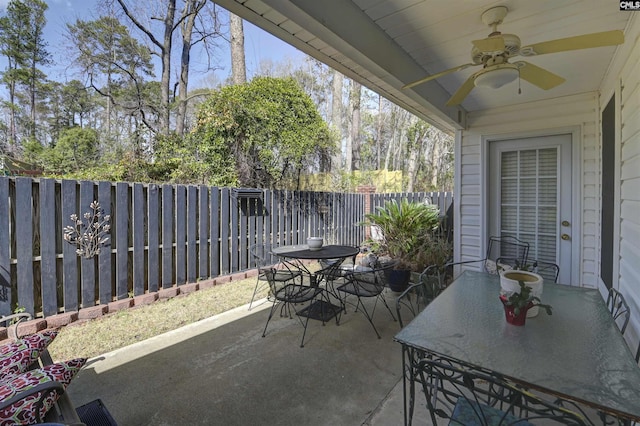 view of patio / terrace with ceiling fan, outdoor dining area, and a fenced backyard