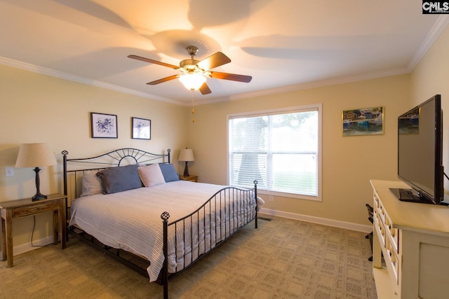 bedroom with a ceiling fan, baseboards, crown molding, and light colored carpet