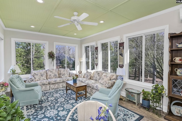 sunroom with a ceiling fan