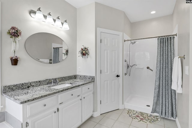 bathroom featuring tile patterned flooring, vanity, and a shower with shower curtain