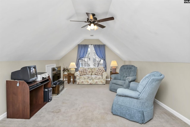 interior space with carpet floors, vaulted ceiling, baseboards, and a ceiling fan