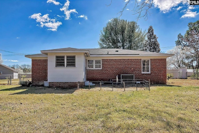 back of property with a yard, fence, and a gate