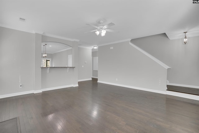 unfurnished living room with dark wood-style floors, crown molding, visible vents, baseboards, and ceiling fan with notable chandelier