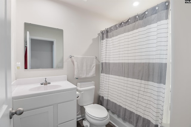 full bath featuring toilet, a shower with curtain, and vanity