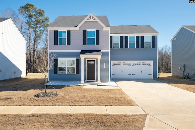 view of front of property with concrete driveway and an attached garage