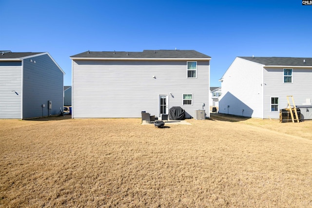 back of house featuring cooling unit