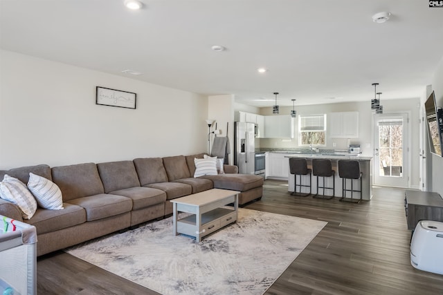 living room featuring dark wood-style floors and recessed lighting