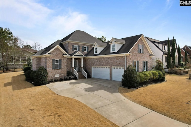 view of front of property featuring driveway, crawl space, and brick siding