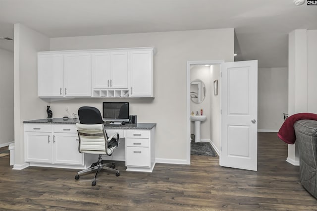 office space featuring baseboards and dark wood-style flooring