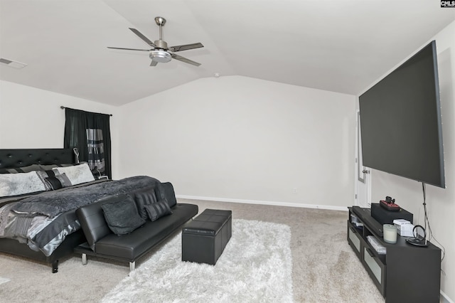 carpeted bedroom featuring vaulted ceiling, baseboards, visible vents, and ceiling fan