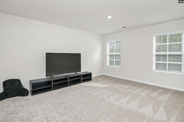 living area featuring recessed lighting, carpet flooring, baseboards, and visible vents