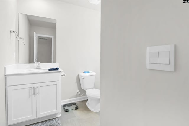 half bathroom with visible vents, toilet, vanity, and baseboards