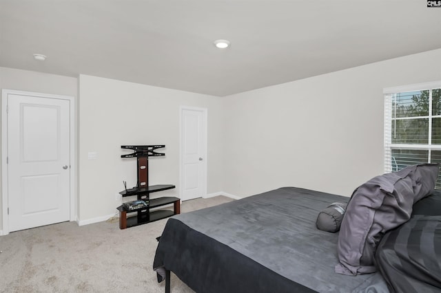 carpeted bedroom with baseboards