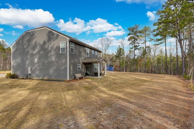 view of property exterior featuring a lawn