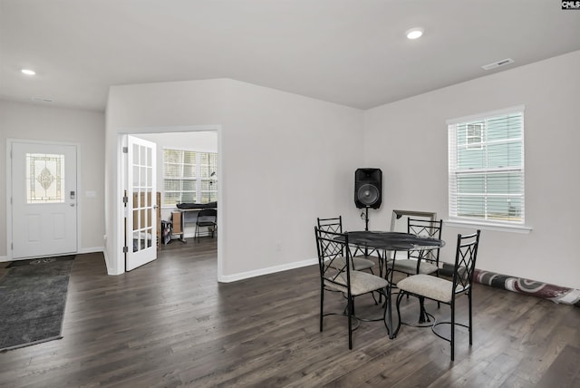 dining space with dark wood-style floors, visible vents, and recessed lighting