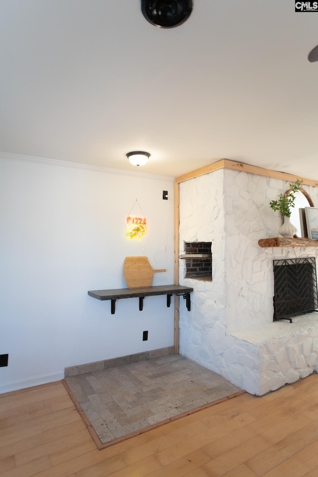 interior space featuring ornamental molding and wood finished floors