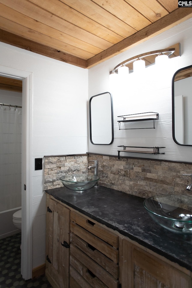 full bath featuring curtained shower, wooden ceiling, vanity, and toilet