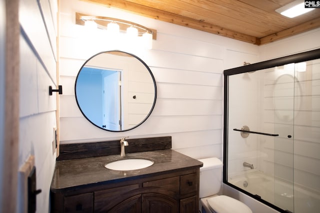 bathroom featuring toilet, wooden ceiling, combined bath / shower with glass door, and vanity