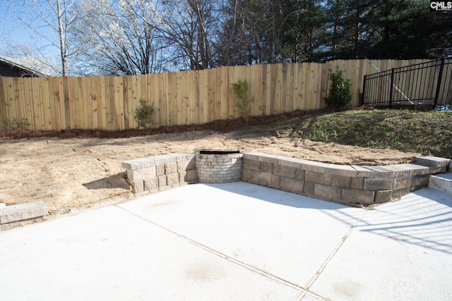 view of patio / terrace featuring fence