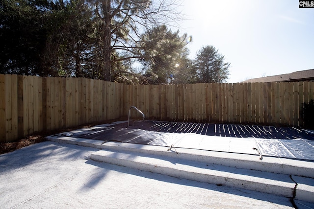 exterior space with a patio area and a fenced backyard