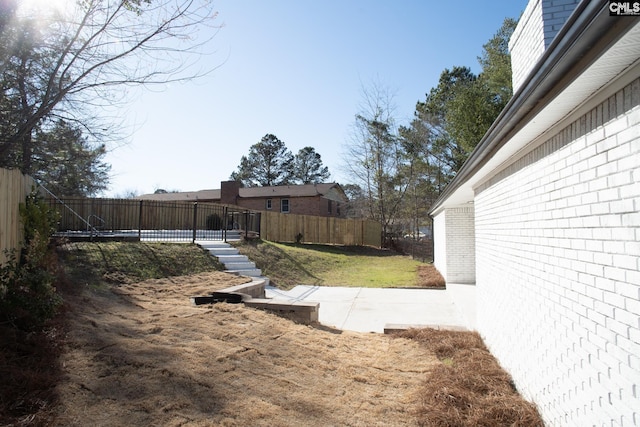 view of yard with a fenced backyard