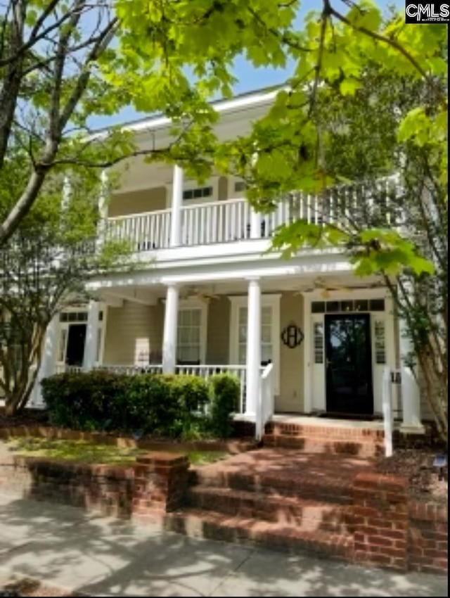 view of front of house with a balcony and a porch