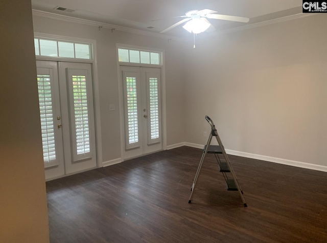 entrance foyer featuring plenty of natural light, french doors, visible vents, and crown molding