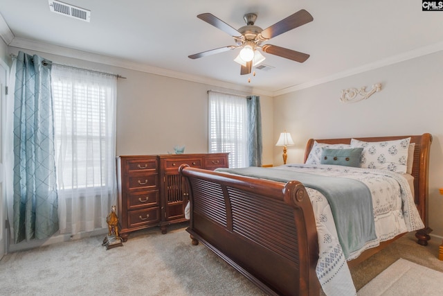 bedroom featuring visible vents, ornamental molding, and light colored carpet