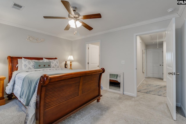 bedroom featuring attic access, visible vents, ornamental molding, and light carpet