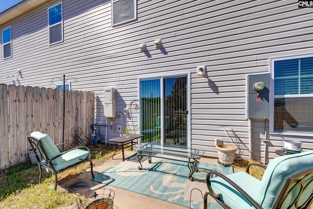 view of patio featuring fence