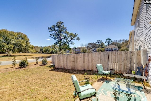 view of yard featuring a patio area and fence