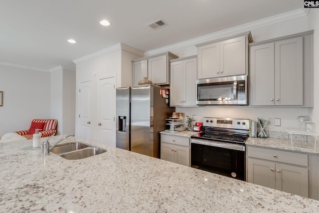 kitchen featuring appliances with stainless steel finishes, visible vents, and gray cabinetry