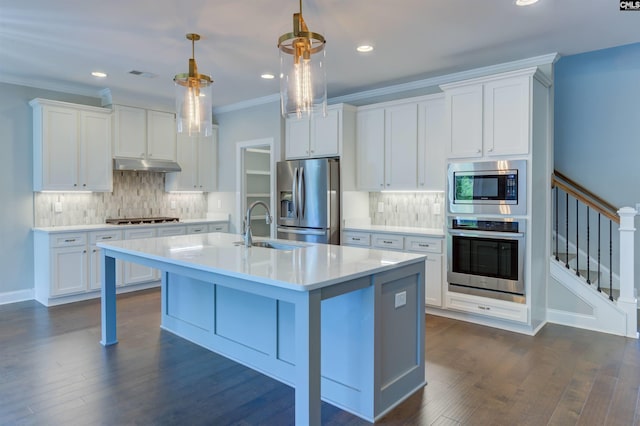 kitchen featuring visible vents, ornamental molding, stainless steel appliances, light countertops, and under cabinet range hood