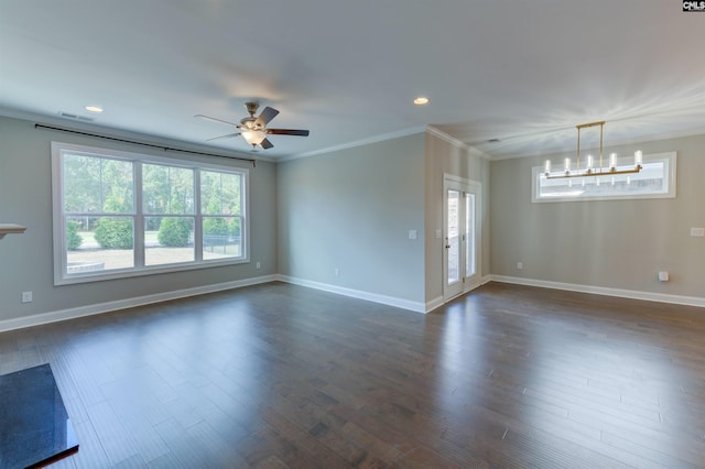 unfurnished room with a healthy amount of sunlight, dark wood finished floors, and crown molding